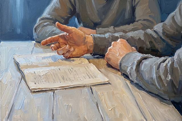 A close view of two pairs of model hands resting either side of an open document on a table.