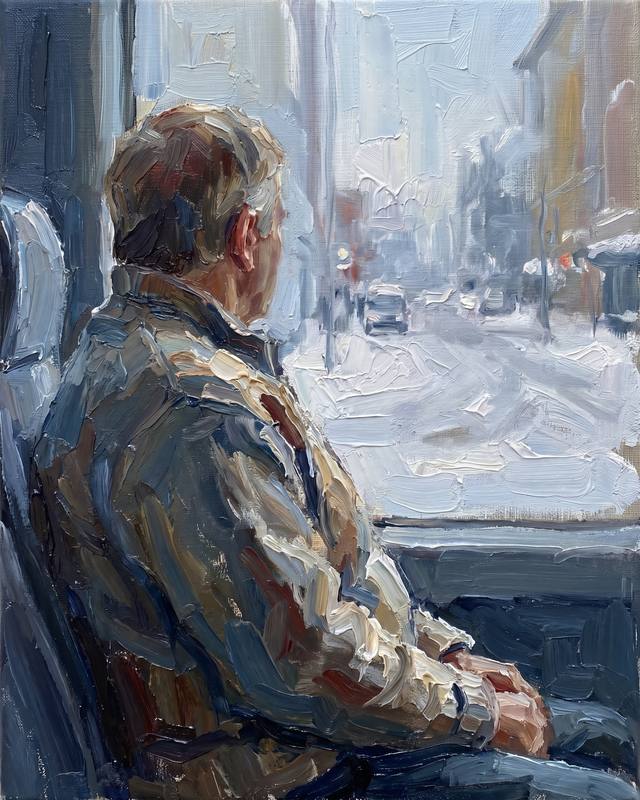 A scale model of a person seen close from behind, sitting at a window looking out.